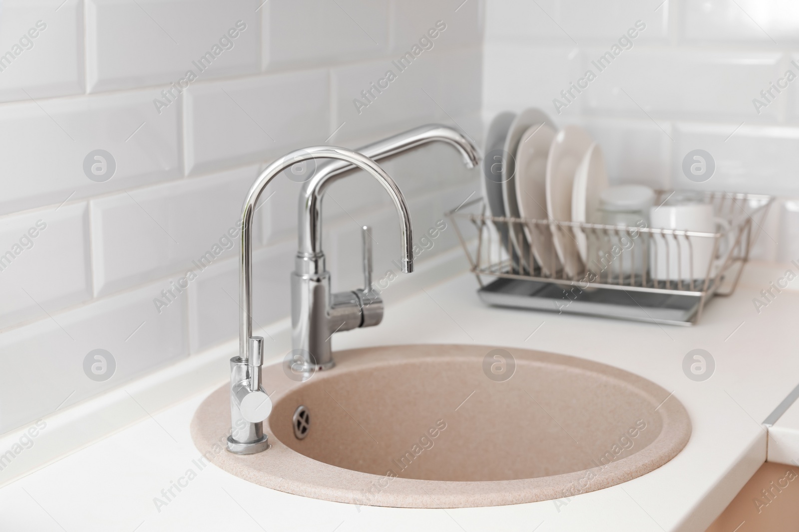 Photo of Empty kitchen sink with faucets. Idea for interior design