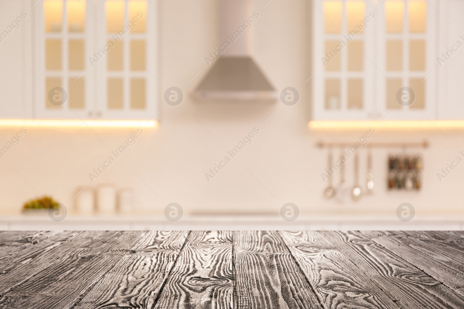 Image of Empty wooden table and blurred view of stylish kitchen interior. Mockup for design