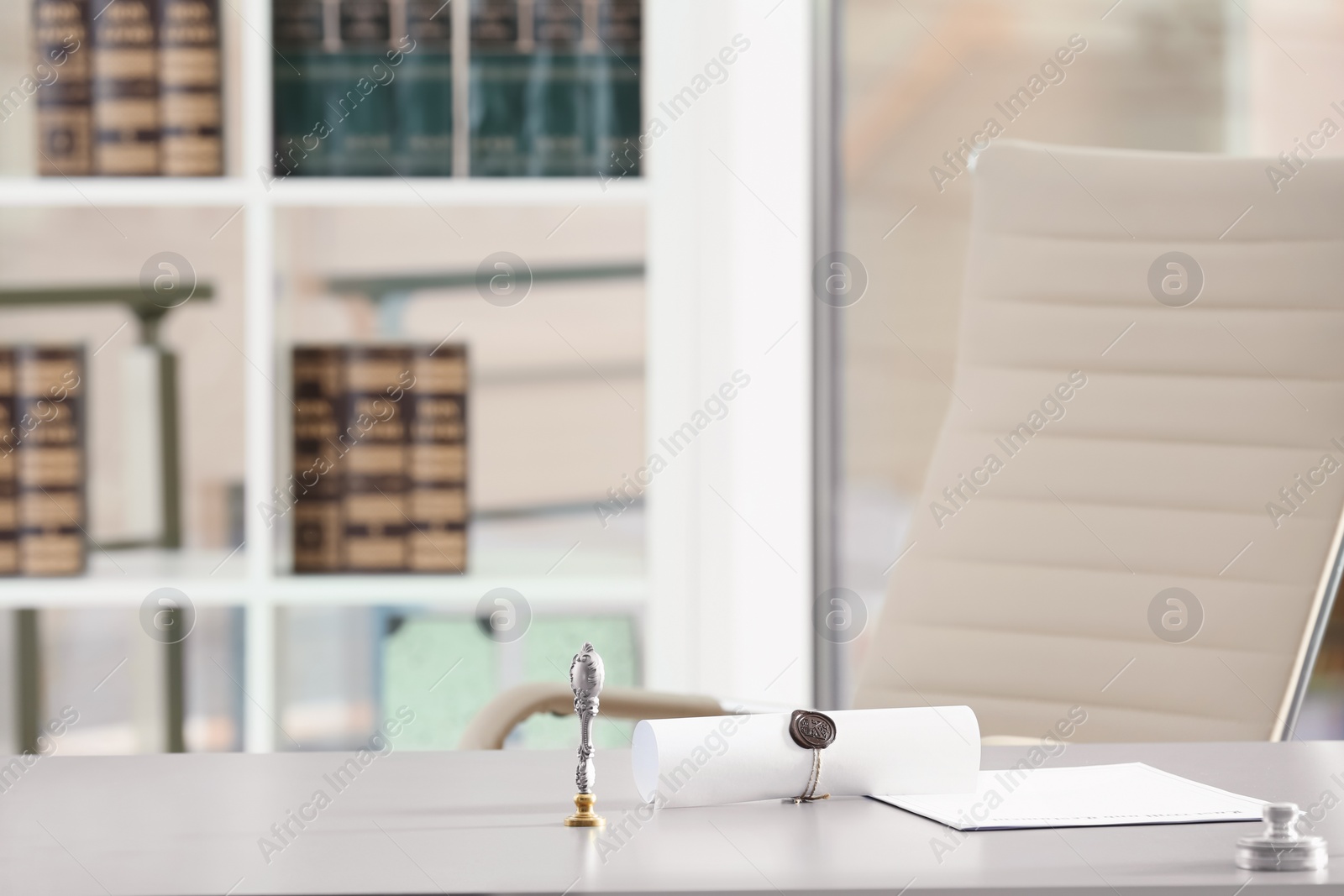 Photo of Stamps and documents on desk in notary's office. Space for text