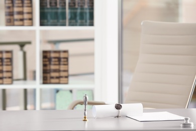 Stamps and documents on desk in notary's office. Space for text