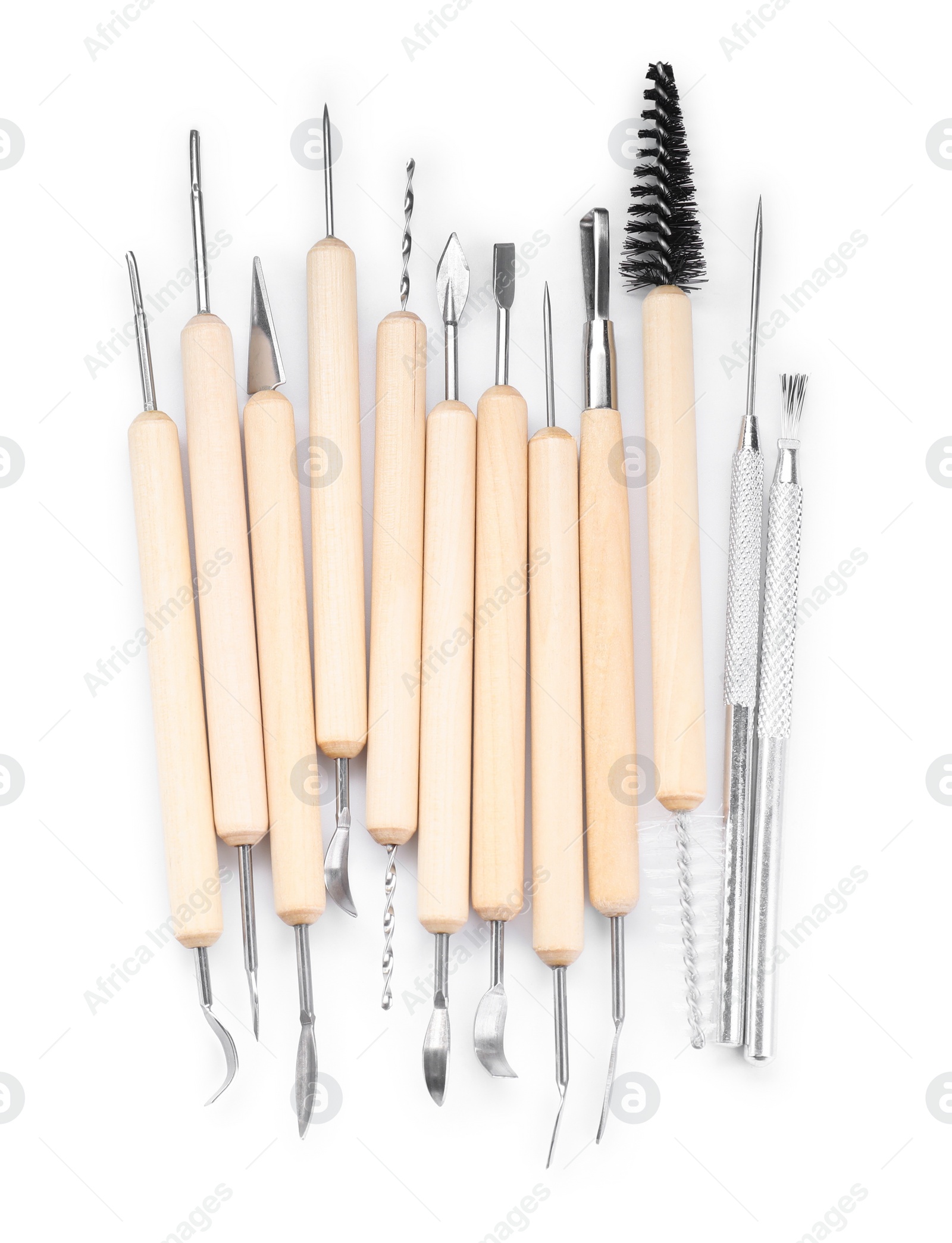 Photo of Set of different clay crafting tools isolated on white, top view