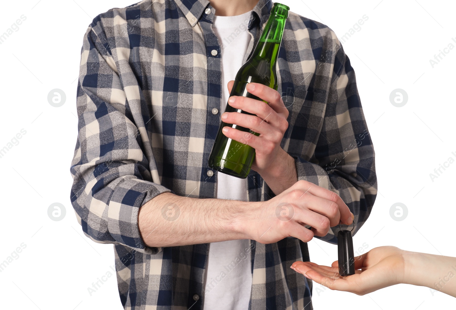 Photo of Man with bottle of beer giving car key to woman on white background, closeup. Don't drink and drive concept