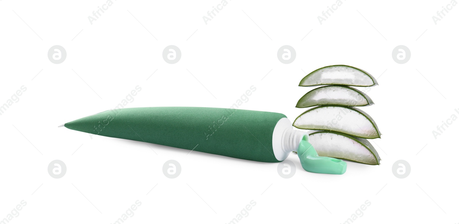 Photo of Open tube of toothpaste with cut aloe vera on white background