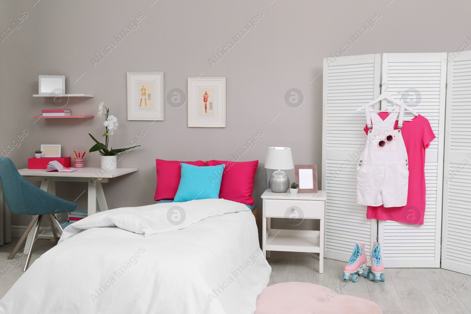 Photo of Modern teenager's room interior with comfortable bed and workplace