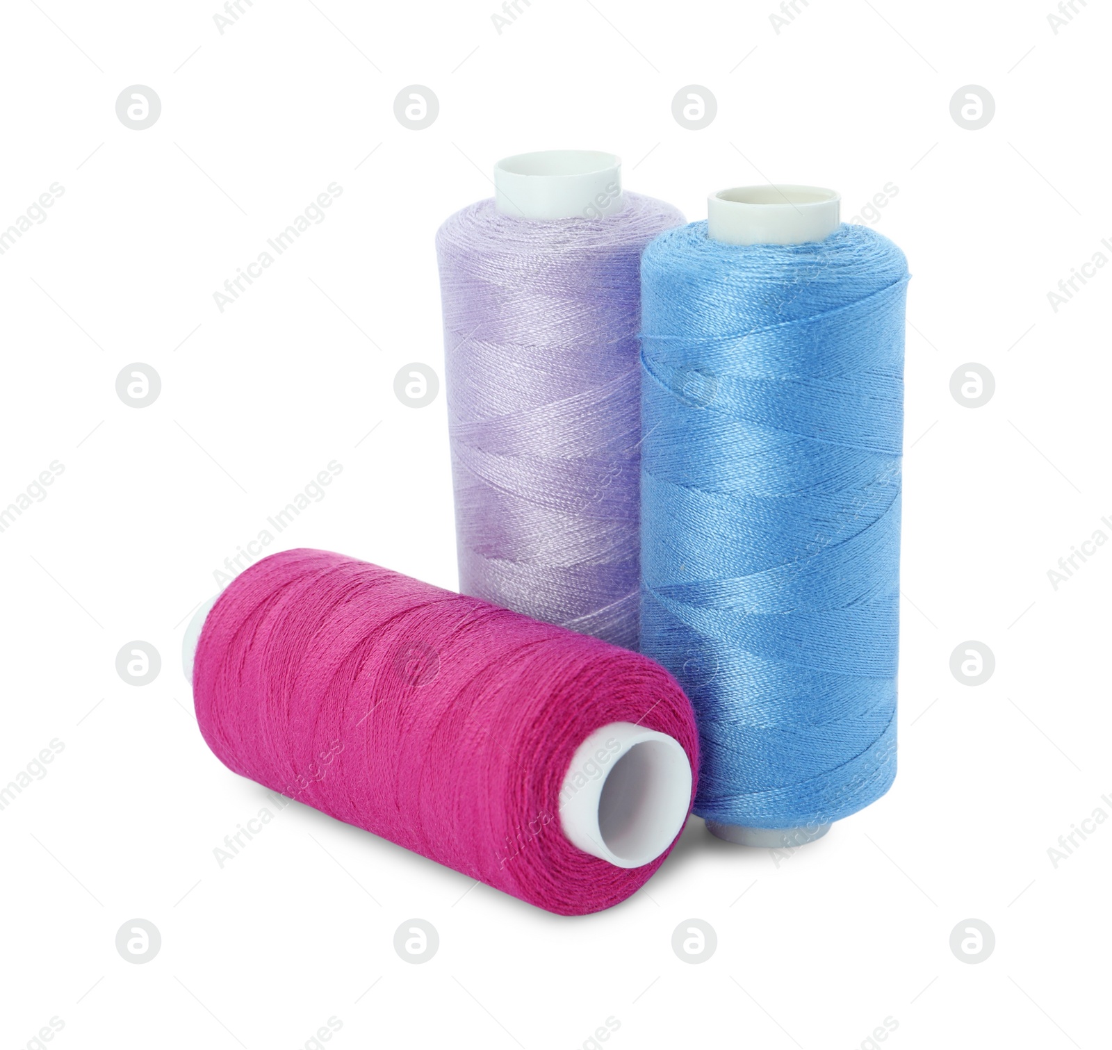 Photo of Different colorful sewing threads on white background