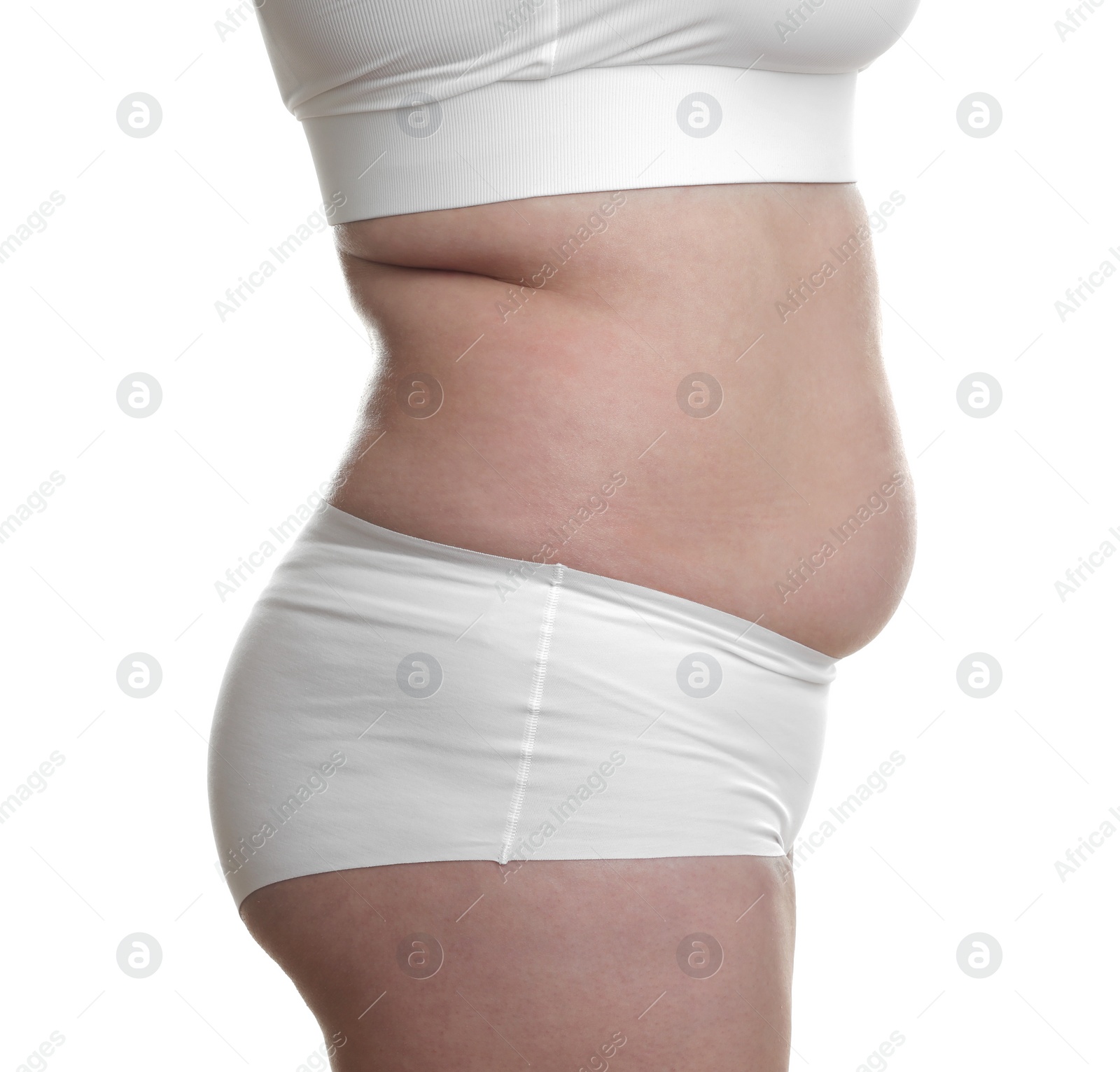 Photo of Woman with excessive belly fat on white background, closeup. Overweight problem