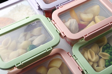 Photo of Plastic boxes with prepared meal on table