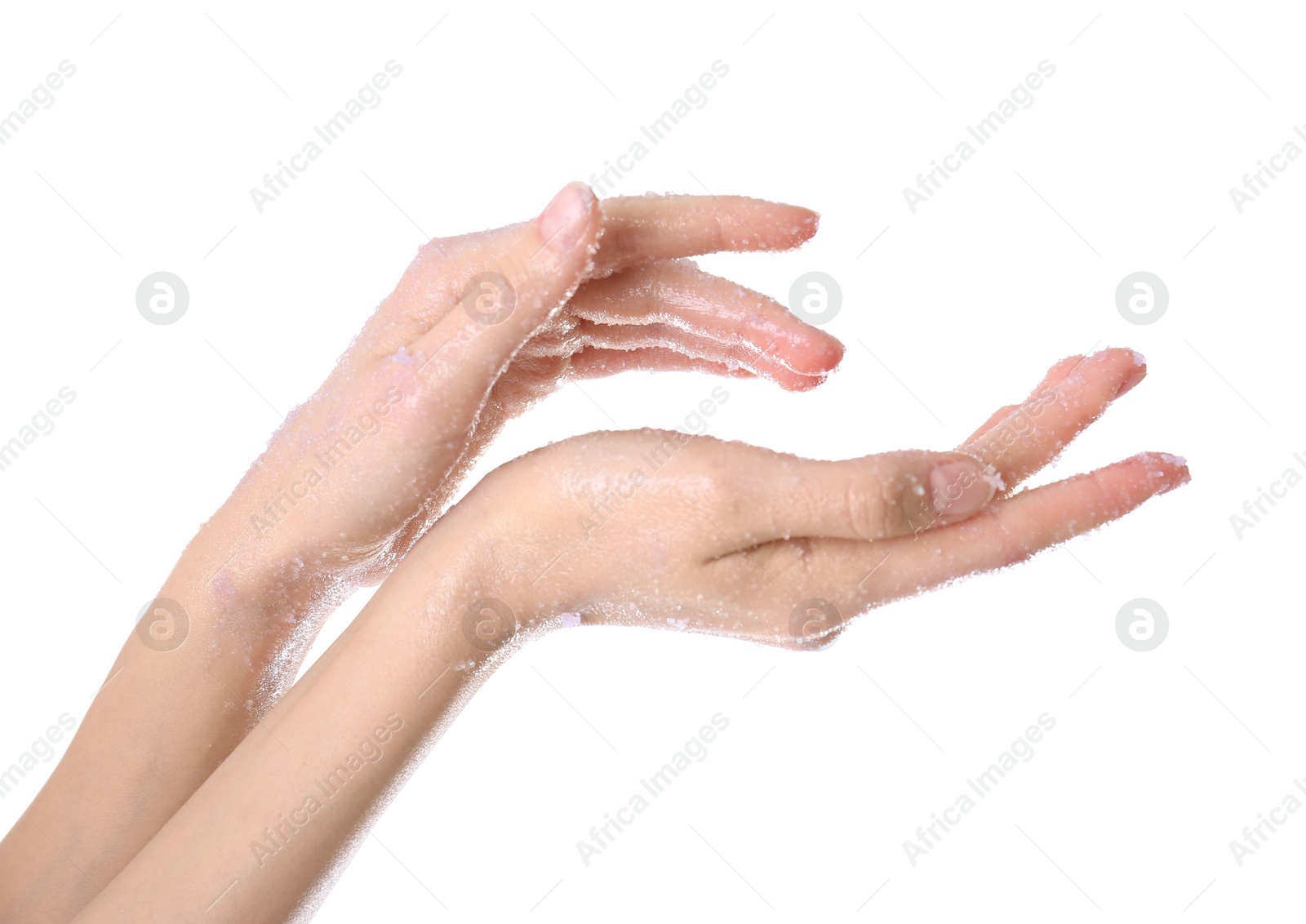 Photo of Young woman applying natural scrub on hands against white background