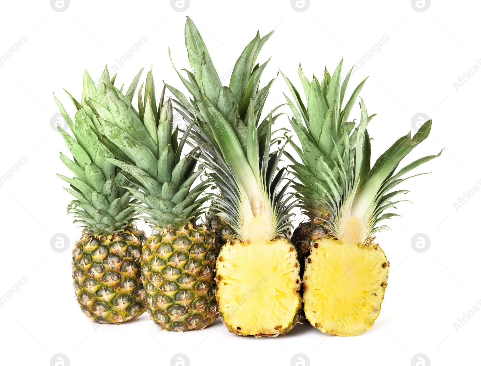 Photo of Whole and cut juicy pineapples isolated on white