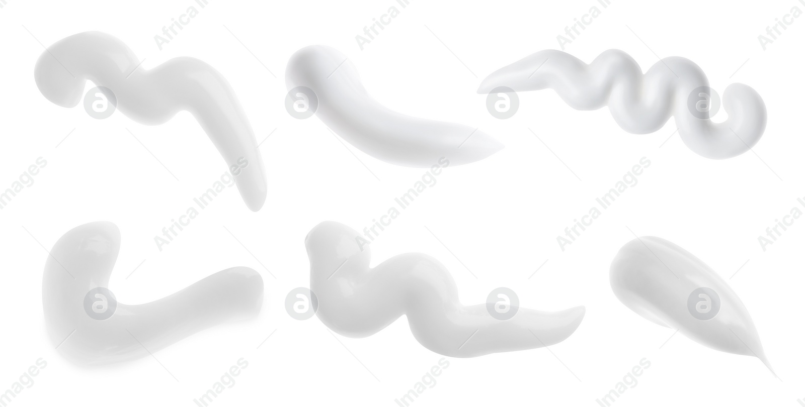 Image of Set with smears of toothpaste on white background