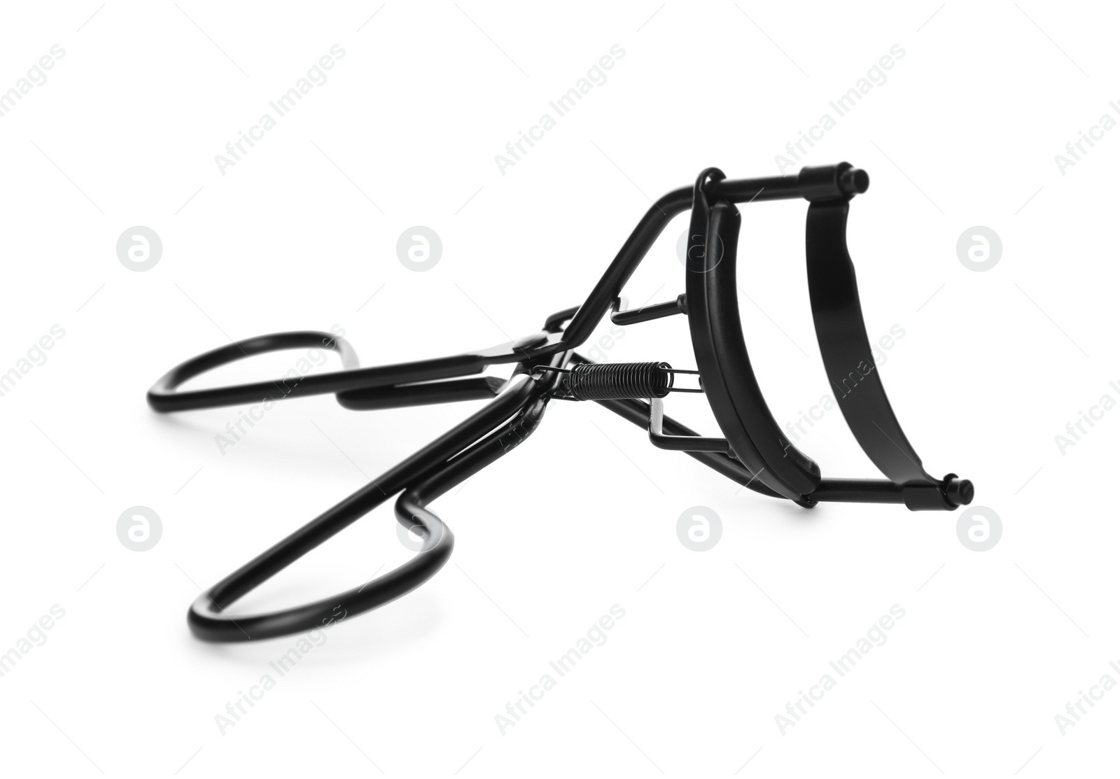 Photo of Eyelash curler isolated on white. Makeup tool