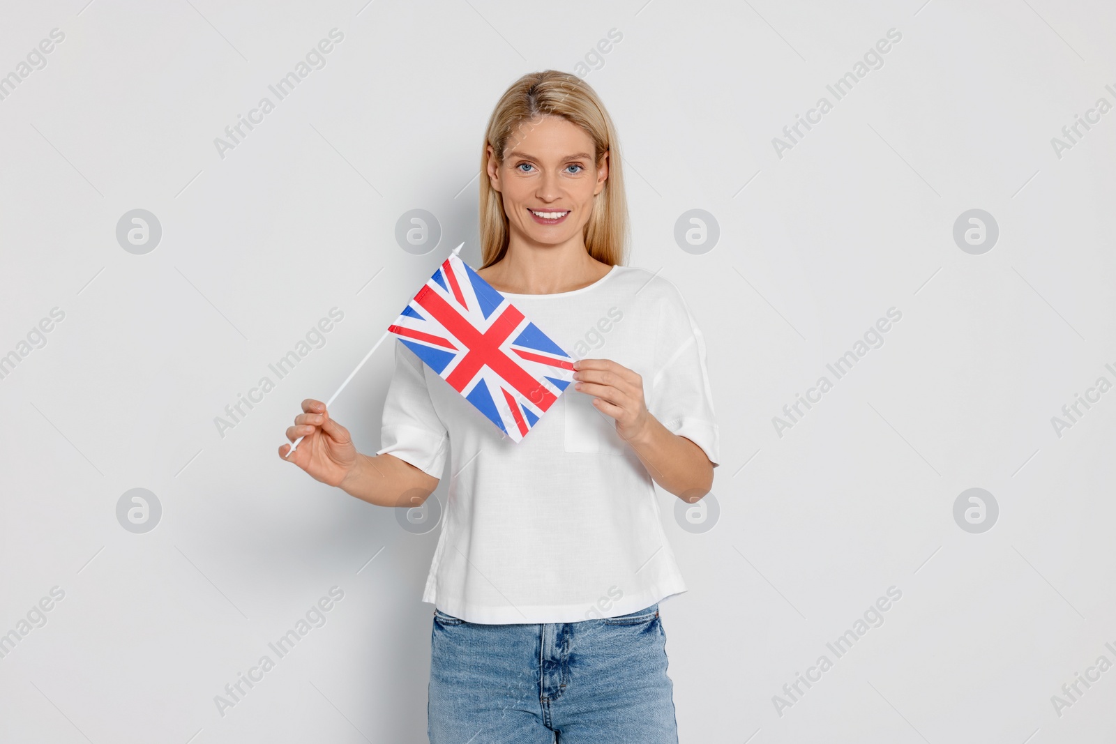 Photo of Woman with flag of United Kingdom on white background