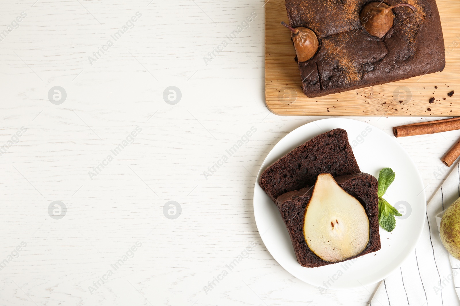 Photo of Flat lay composition with tasty pear bread on white wooden table, space for text. Homemade cake