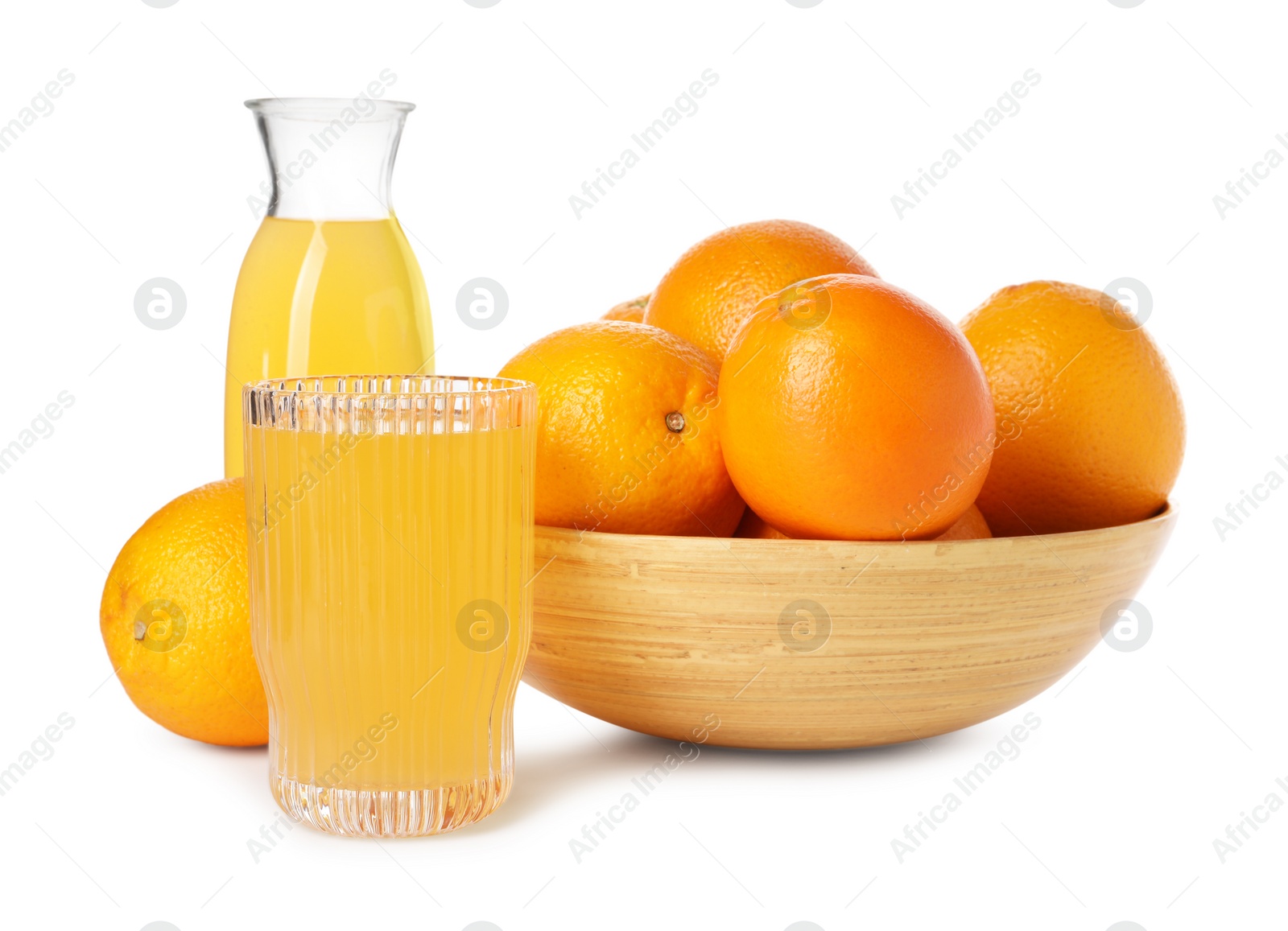 Photo of Fresh oranges in bowl and juice isolated on white