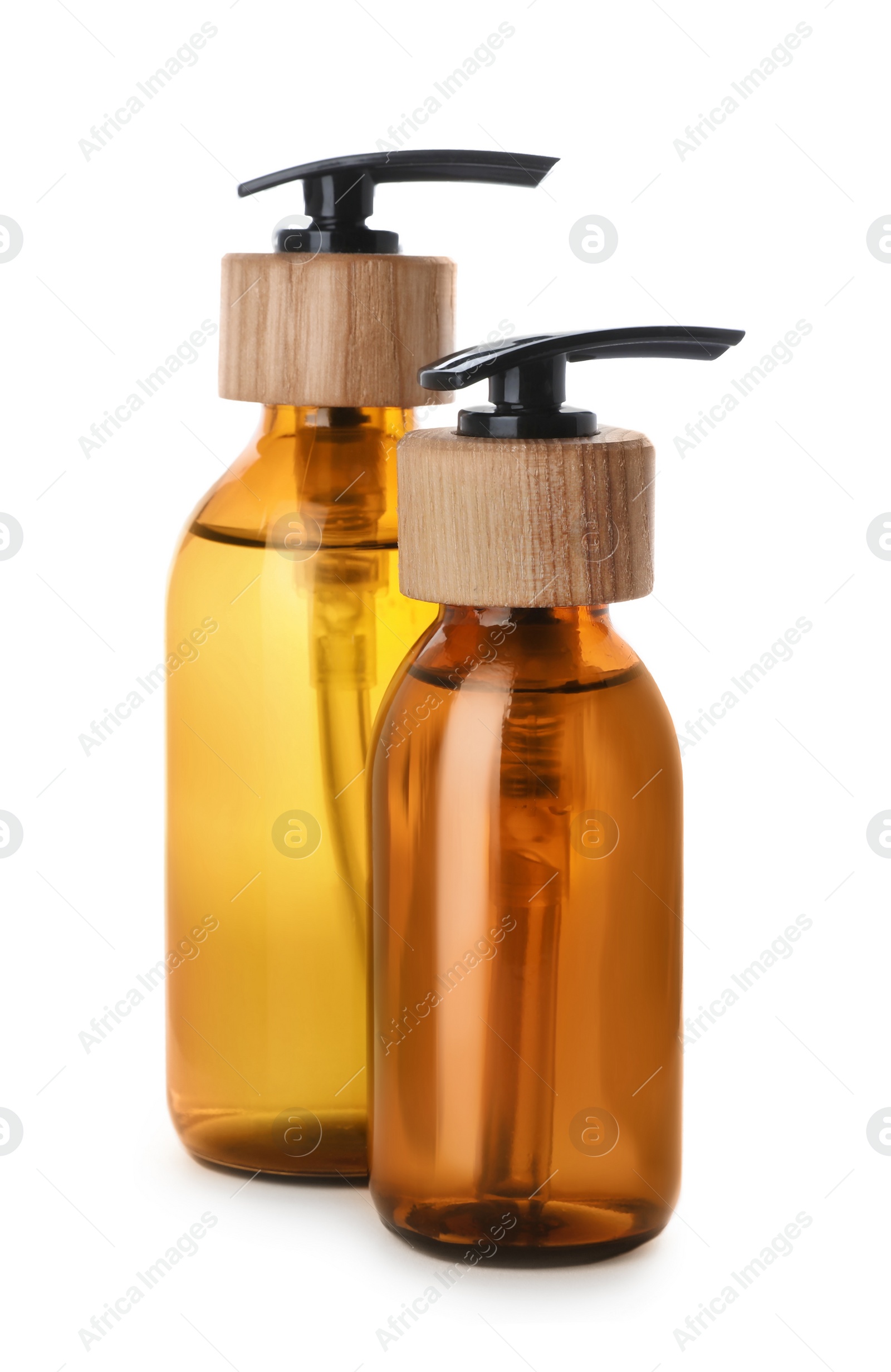 Photo of Bottles with dispenser caps on white background