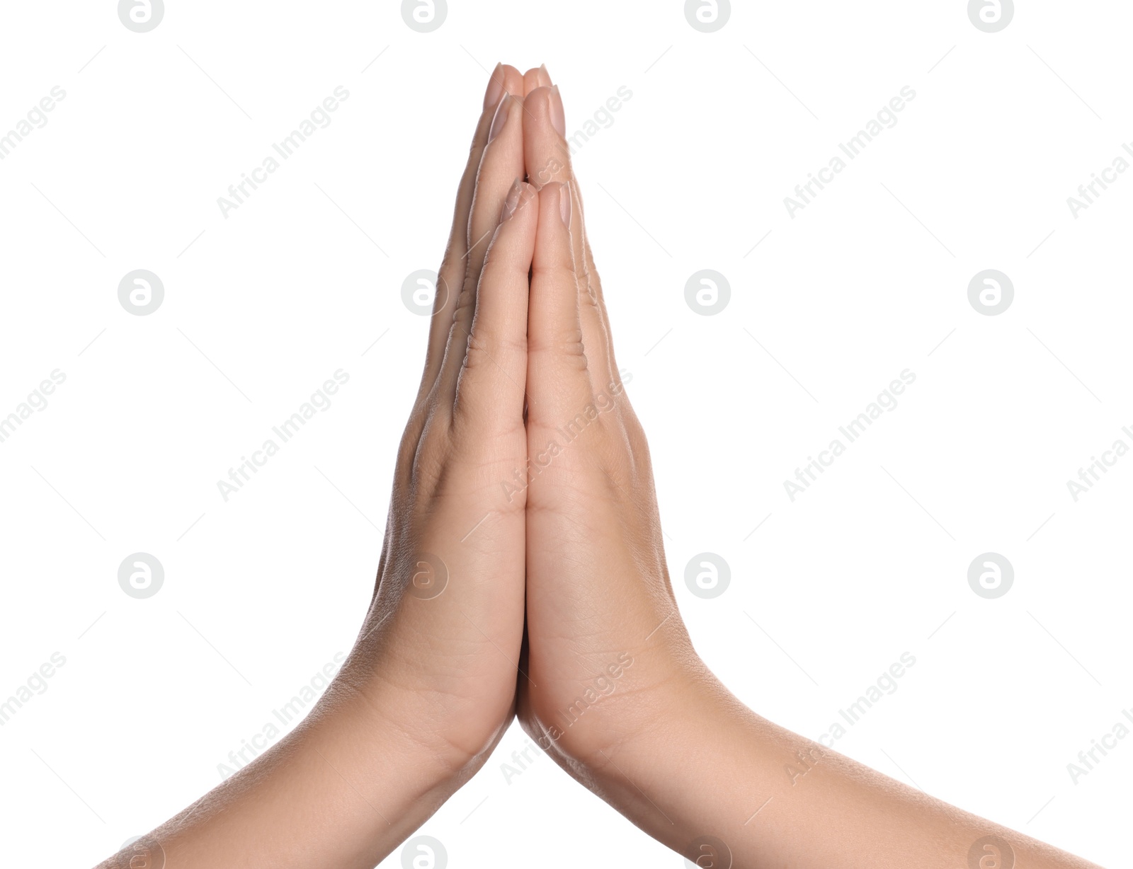 Photo of Woman holding hands clasped while praying on white background, closeup