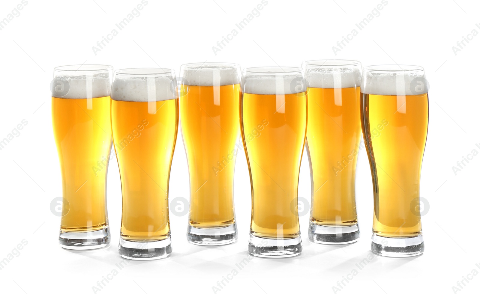 Photo of Glasses of beer on white background