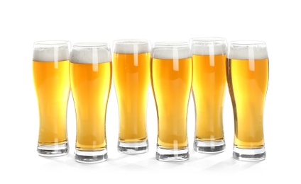 Photo of Glasses of beer on white background