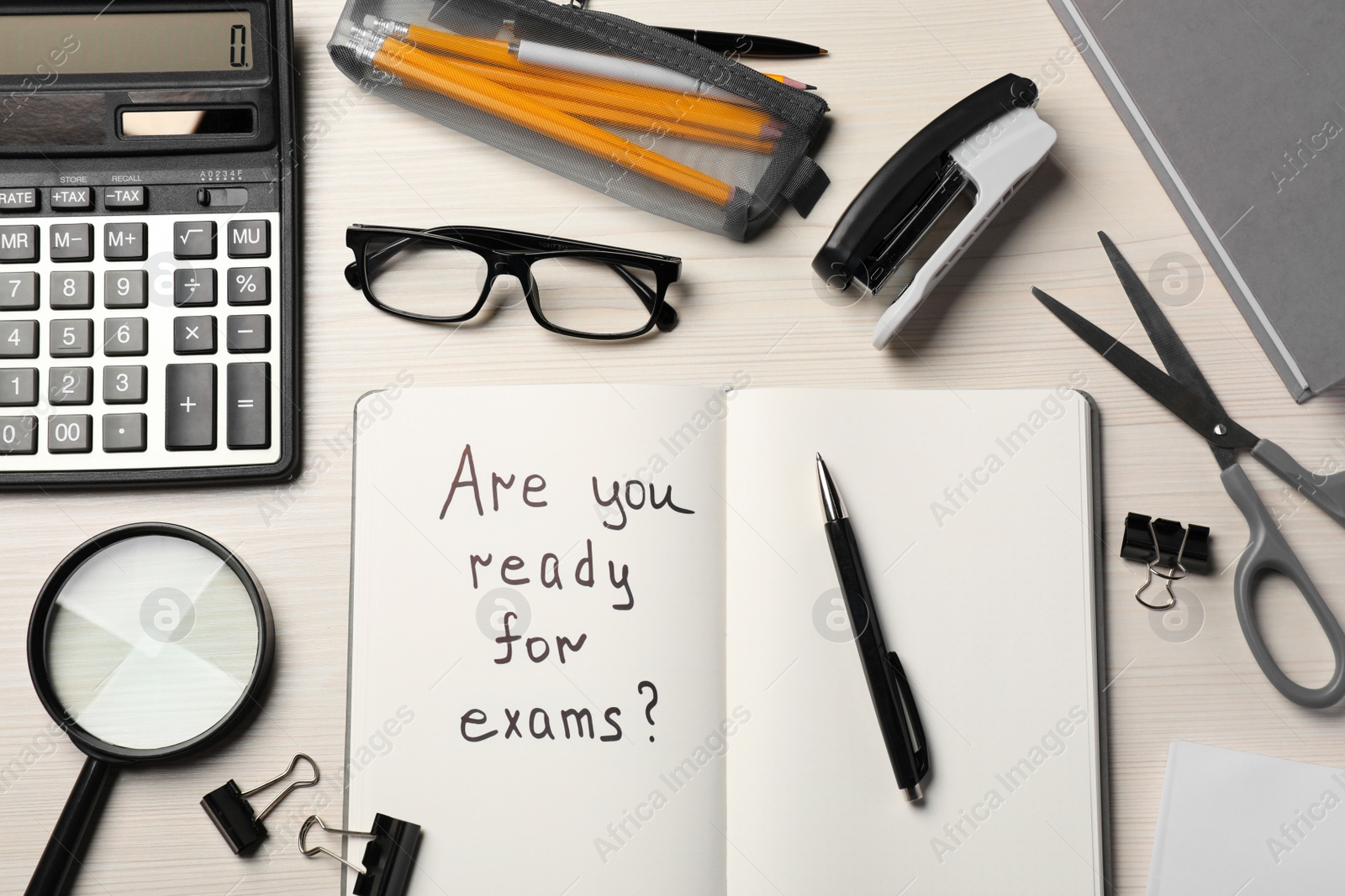 Photo of Notebook with question Are You Ready For Exams? on white wooden table, flat lay