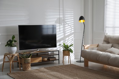 Photo of Living room interior with modern TV on stand