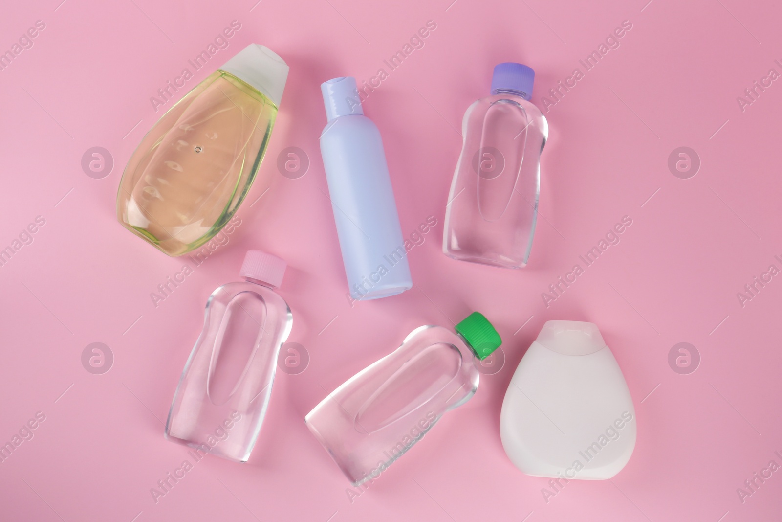 Photo of Different skin care products for baby on pink background, flat lay. Space for text