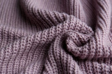 Photo of Beautiful violet knitted fabric as background, closeup