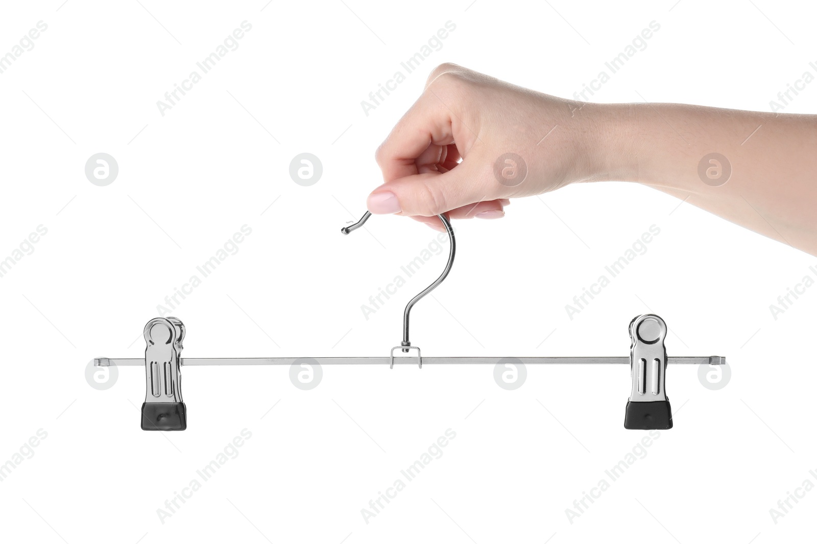 Photo of Woman holding hanger with clips on white background, closeup