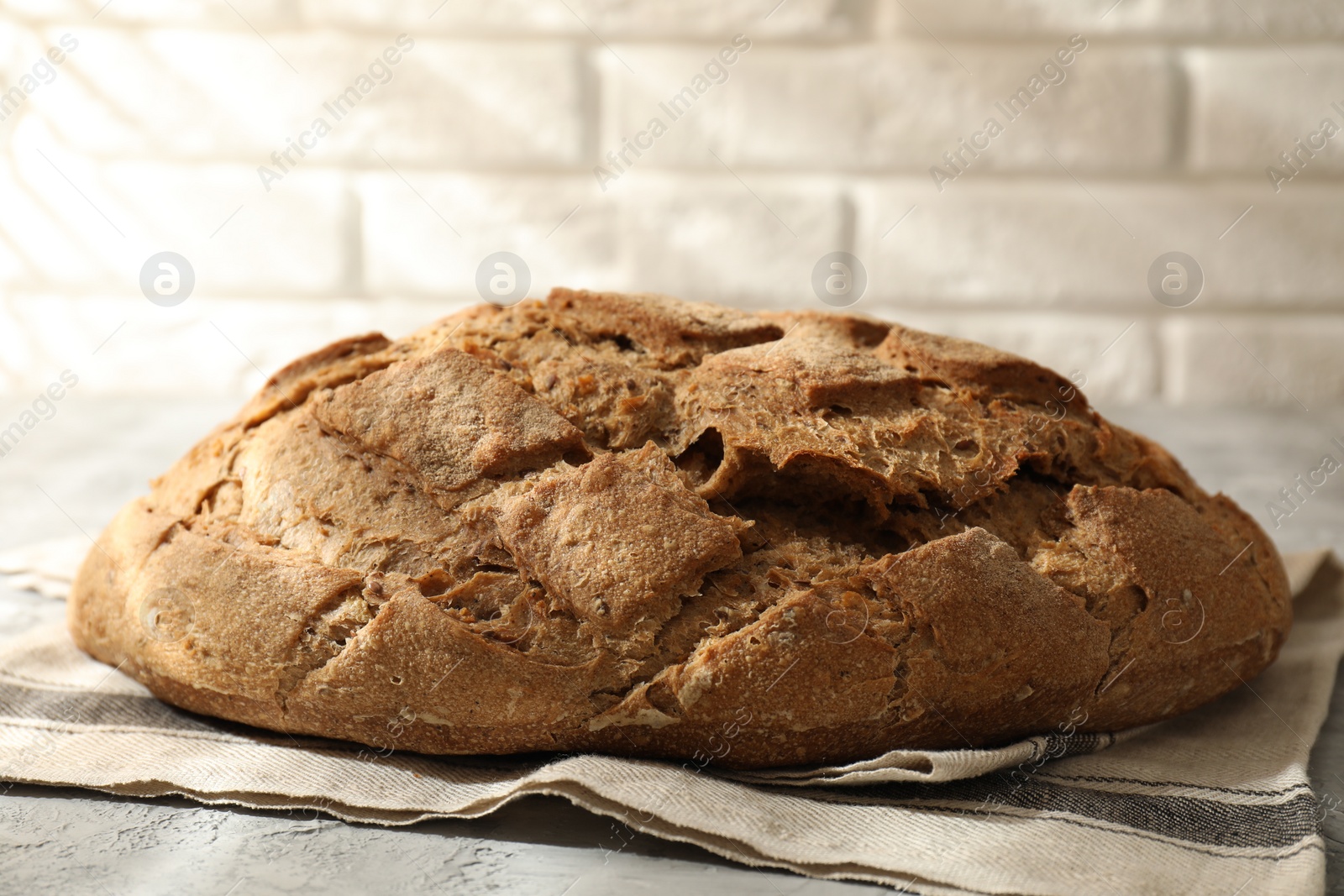 Photo of Freshly baked sourdough bread on grey table