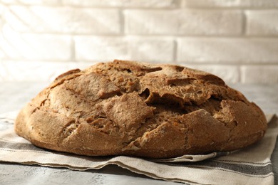 Photo of Freshly baked sourdough bread on grey table