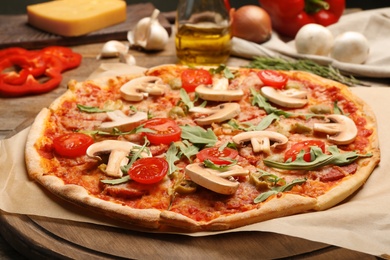 Photo of Hot delicious pizza baked in oven on table