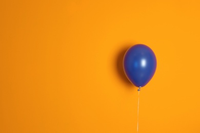 Photo of Purple balloon on color background. Celebration time