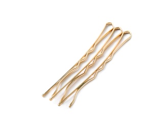 Photo of Many gold hair pins on white background