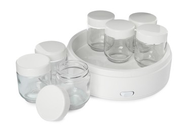 Modern yogurt maker with empty jars on white background