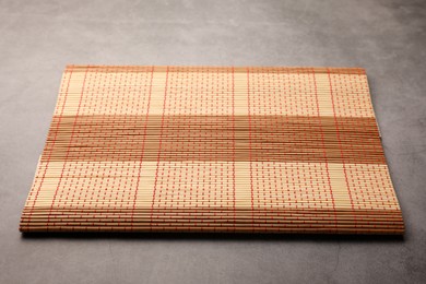 New clean bamboo mat on grey table