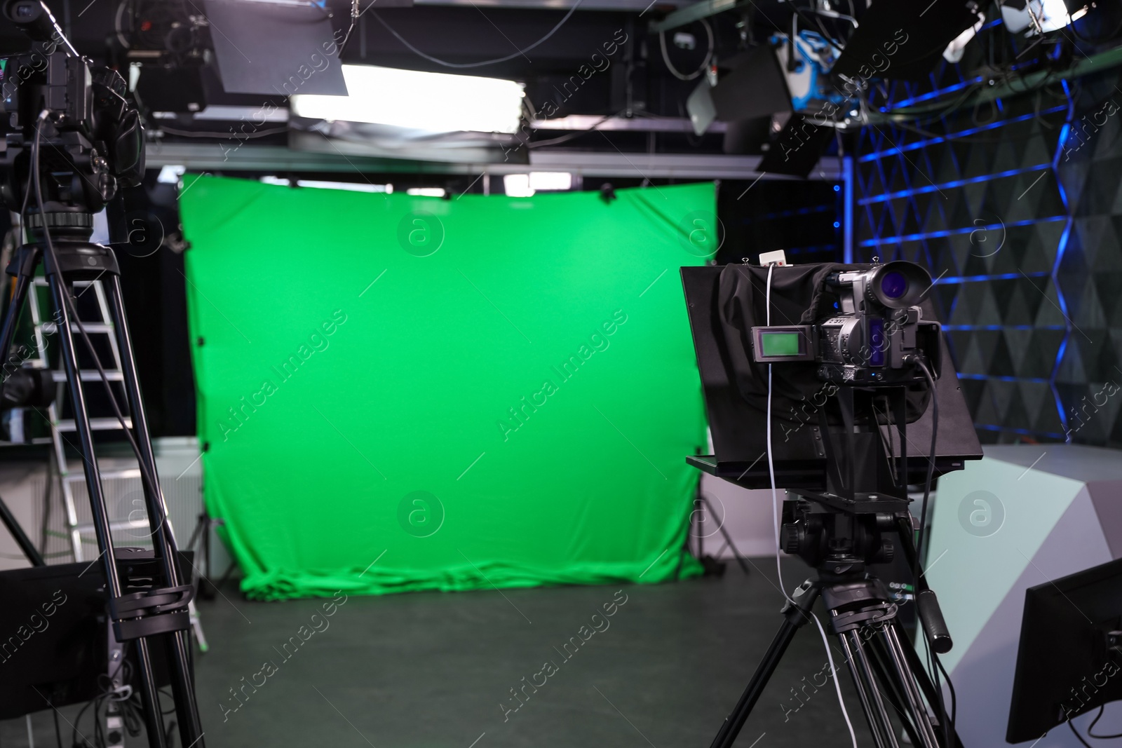 Photo of Modern video recording studio with professional equipment, focus on camera