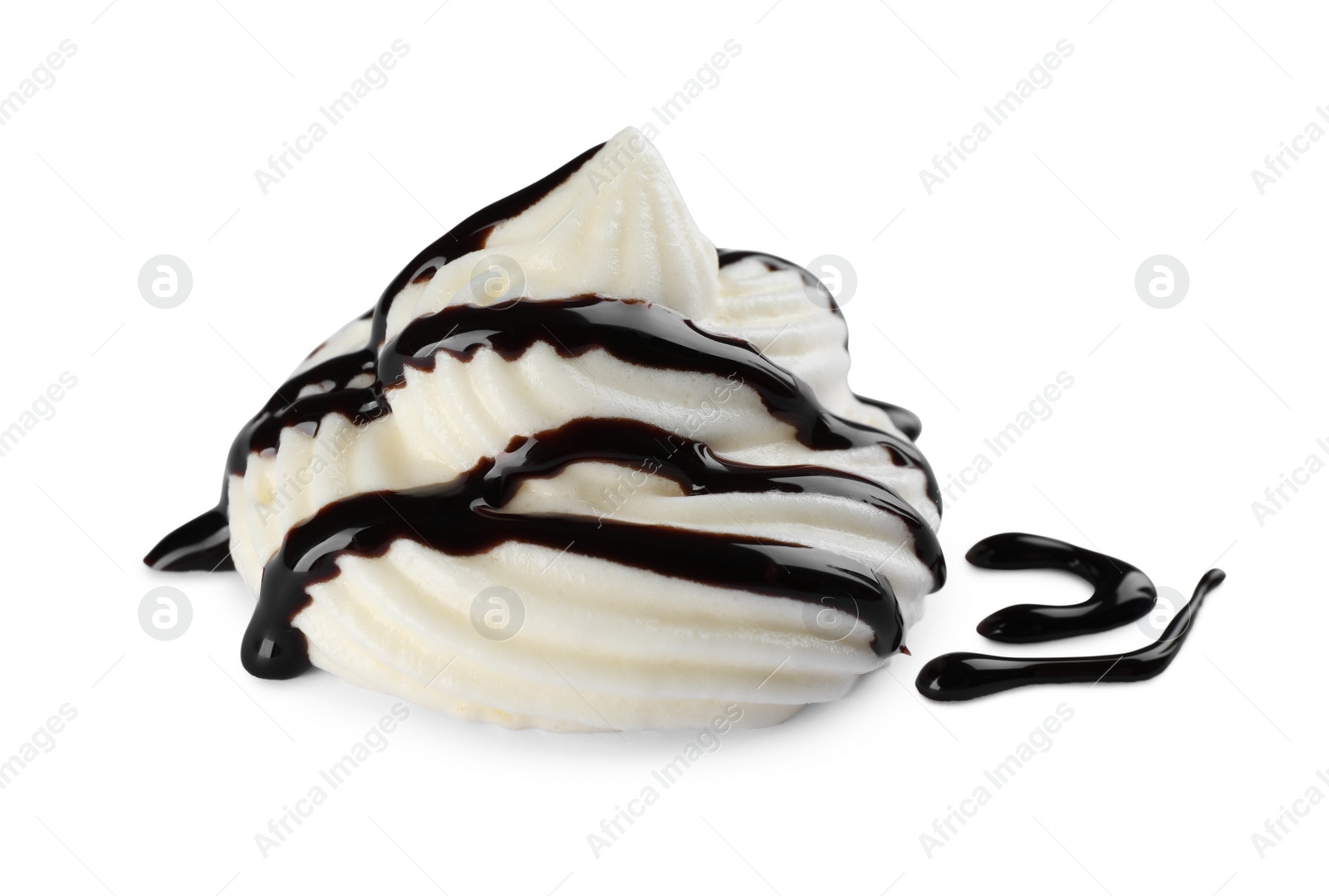 Photo of Delicious fresh whipped cream with chocolate syrup isolated on white