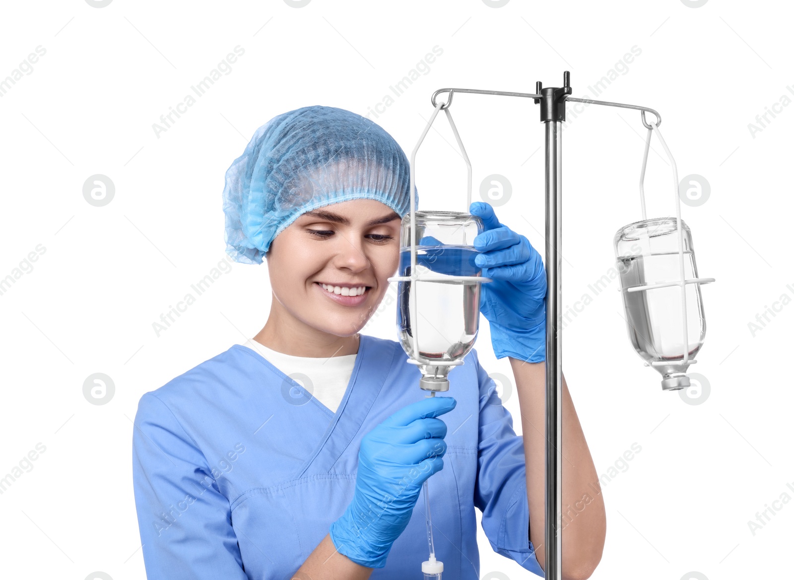 Photo of Nurse setting up IV drip on white background