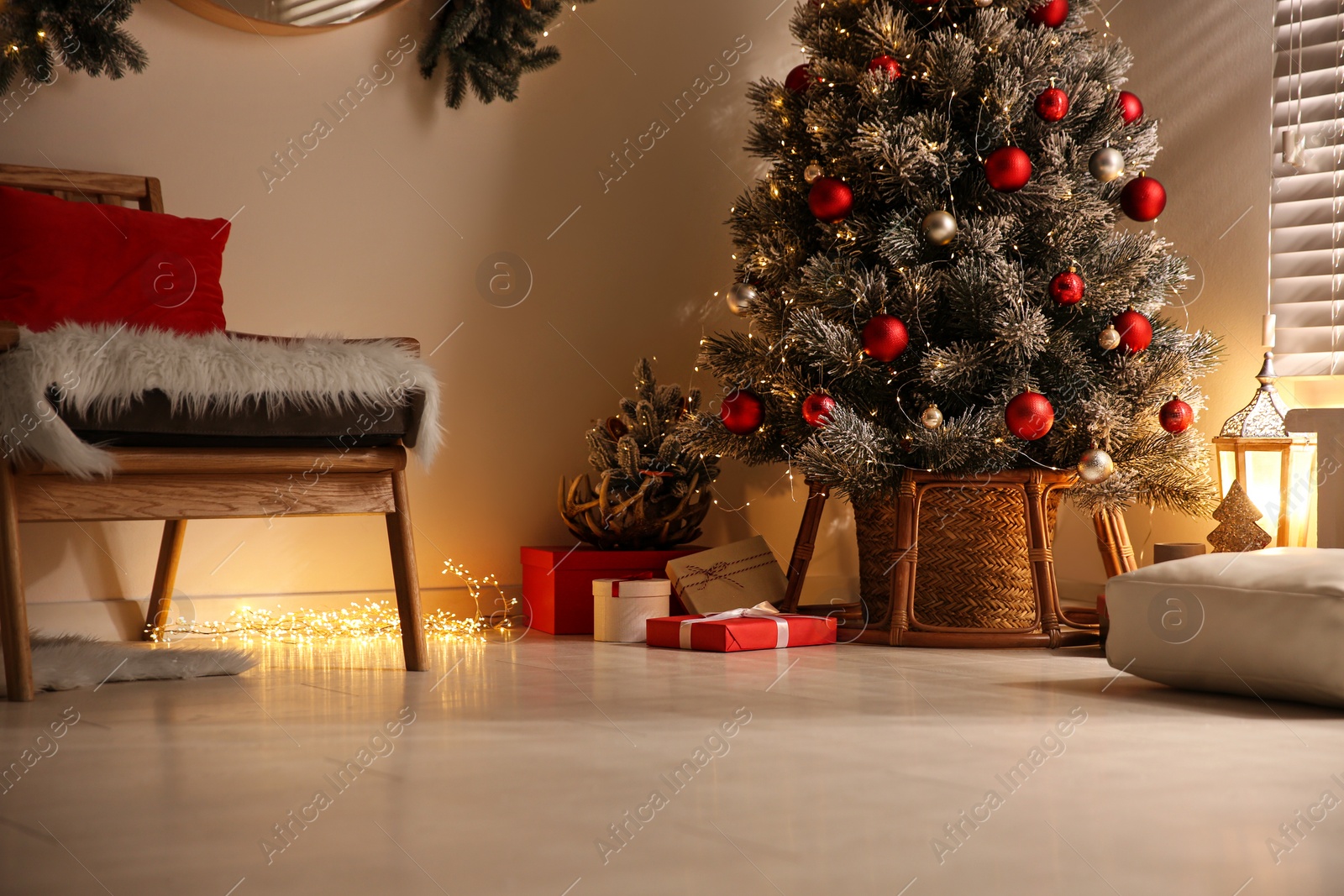 Photo of Beautiful decorated Christmas tree in festive room interior