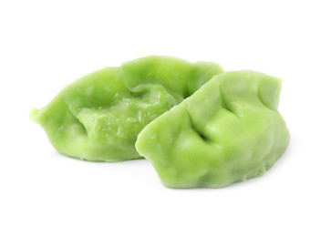 Two delicious green dumplings (gyozas) isolated on white