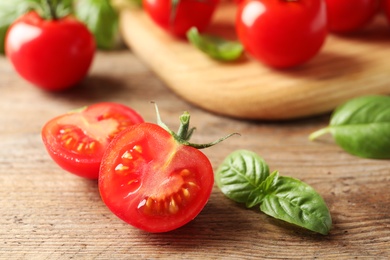 Fresh organic cherry tomatoes on wooden background