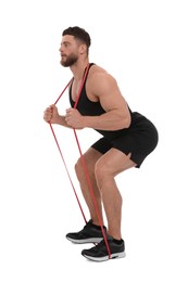 Young man exercising with elastic resistance band on white background