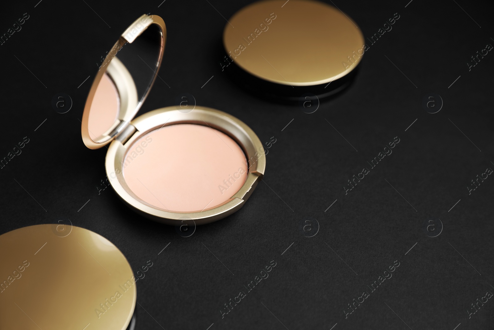 Photo of Face powders on black background, space for text