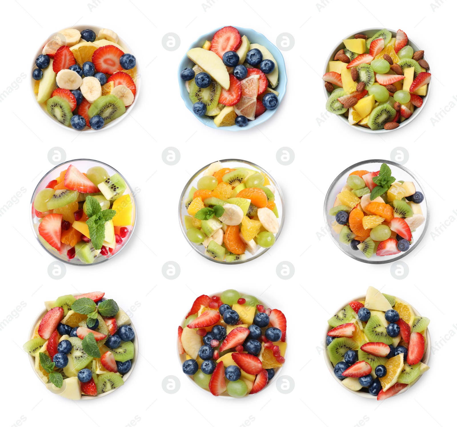 Image of Set of delicious fruit salads in bowls isolated on white, top view