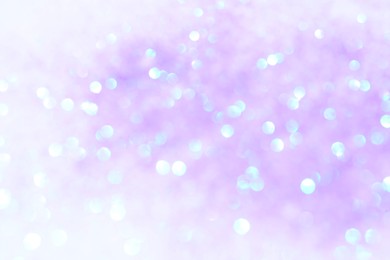 Shiny lilac background with magical bokeh effect