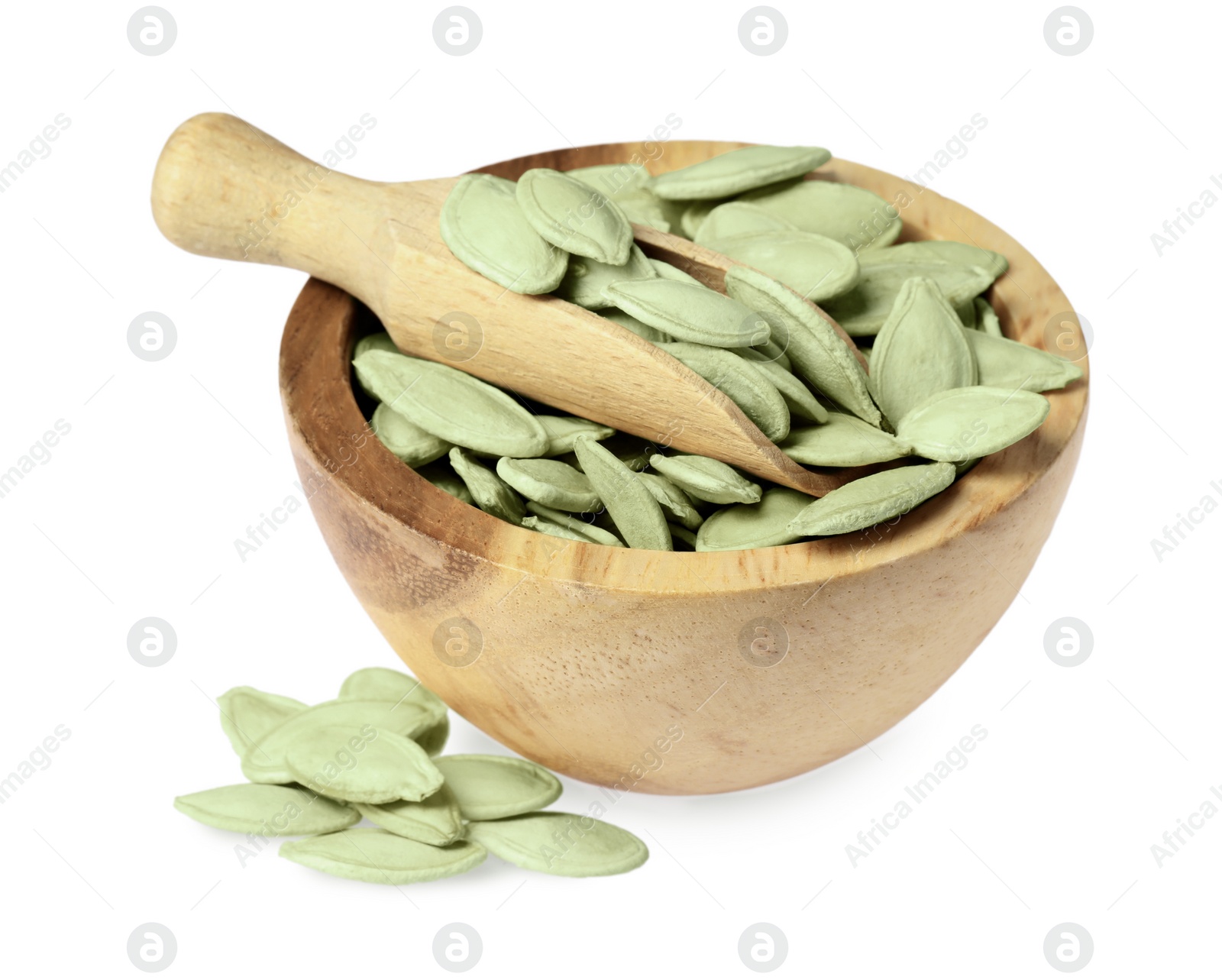 Photo of Wooden bowl with pumpkin seeds and scoop isolated on white