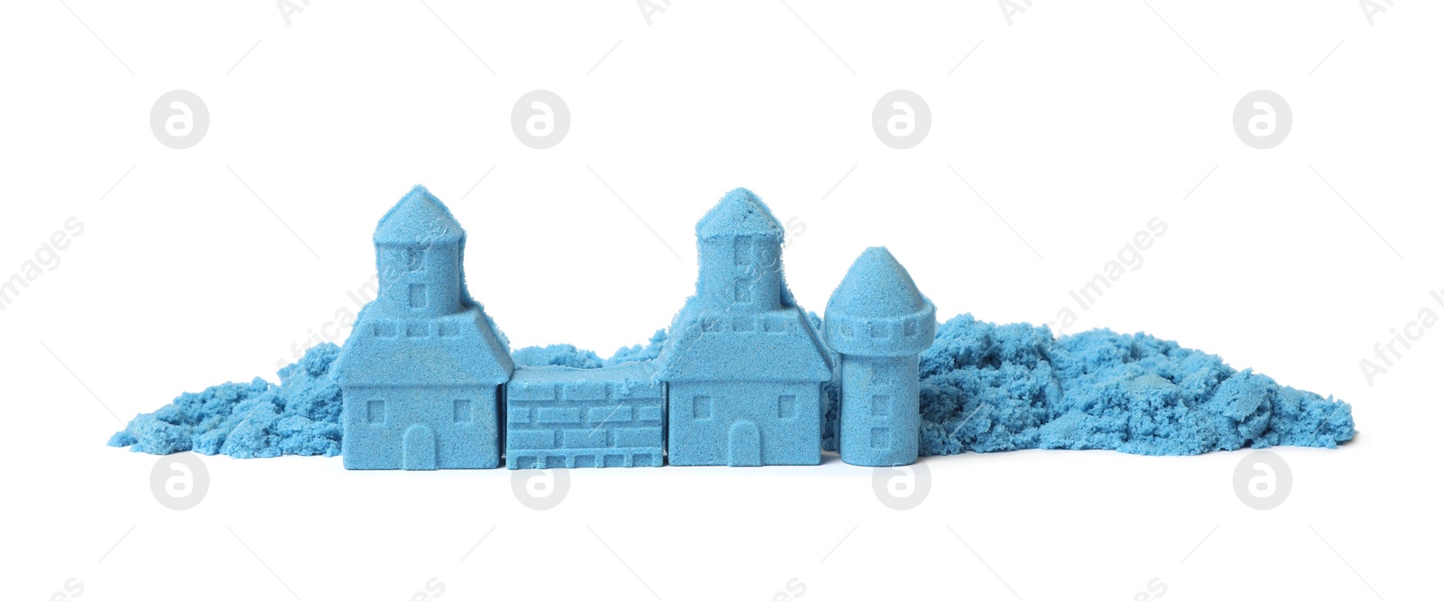 Photo of Castle made of blue kinetic sand isolated on white