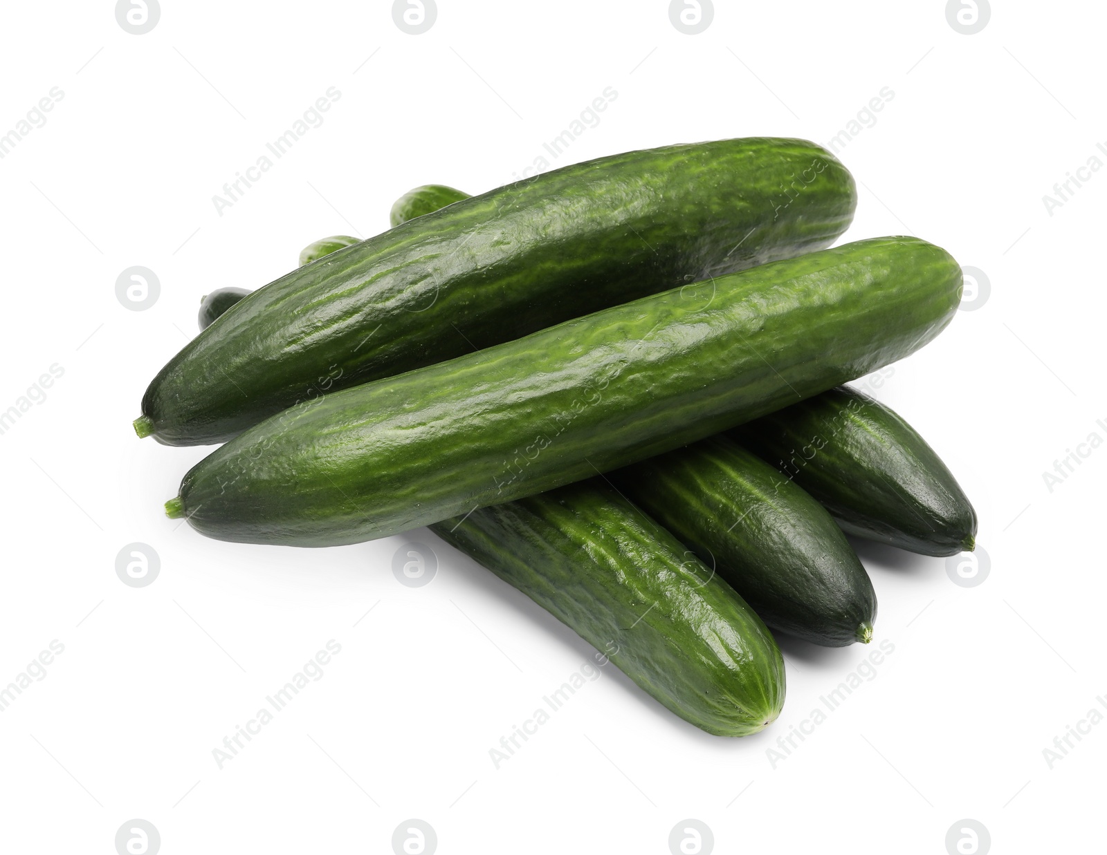 Photo of Many long fresh cucumbers isolated on white