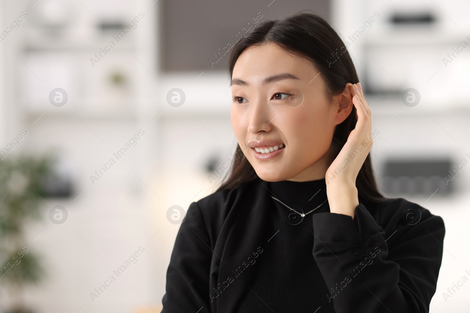 Photo of Portrait of smiling confident businesswoman in office
