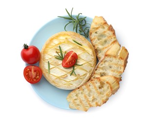 Photo of Tasty baked brie cheese with rosemary, cherry tomatoes and bread isolated on white, top view