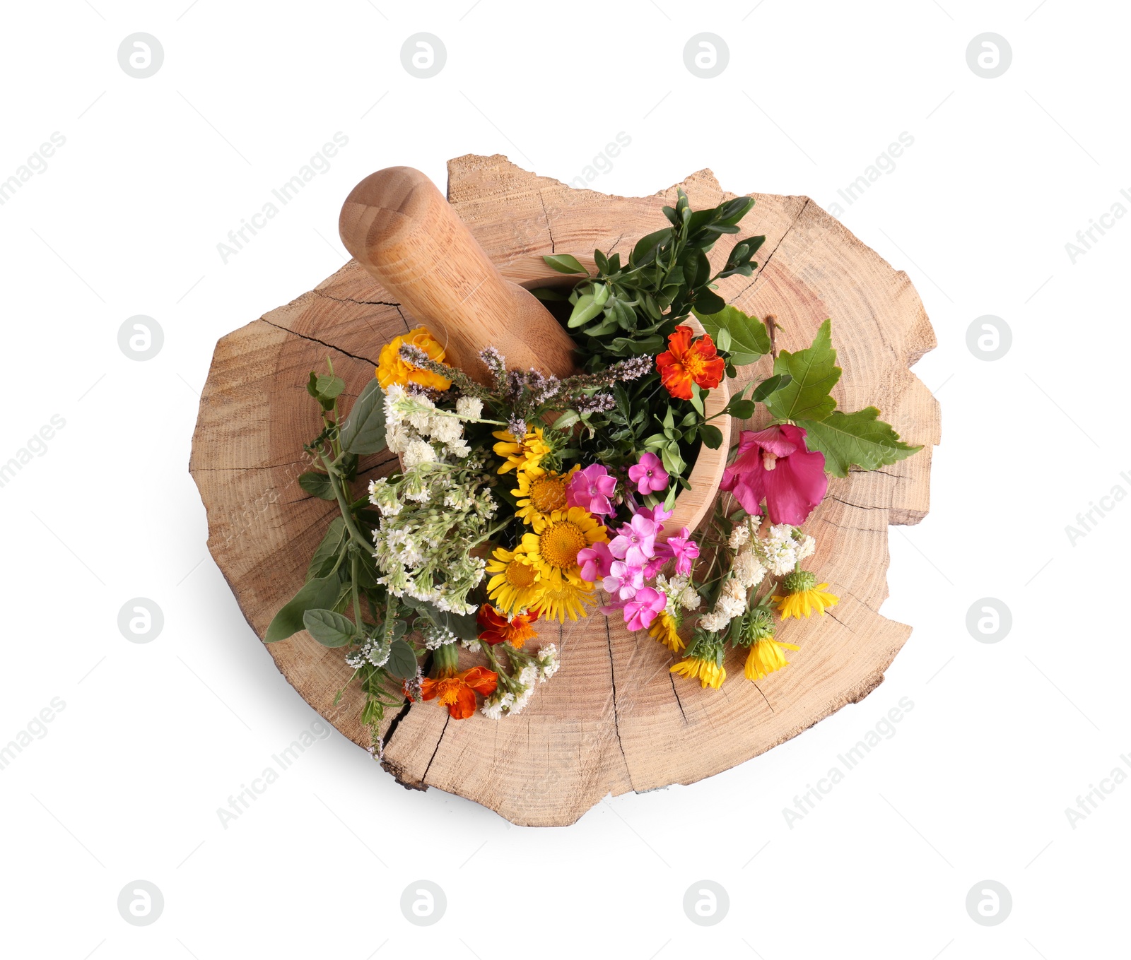 Photo of Wooden mortar, pestle and different flowers on white background, top view